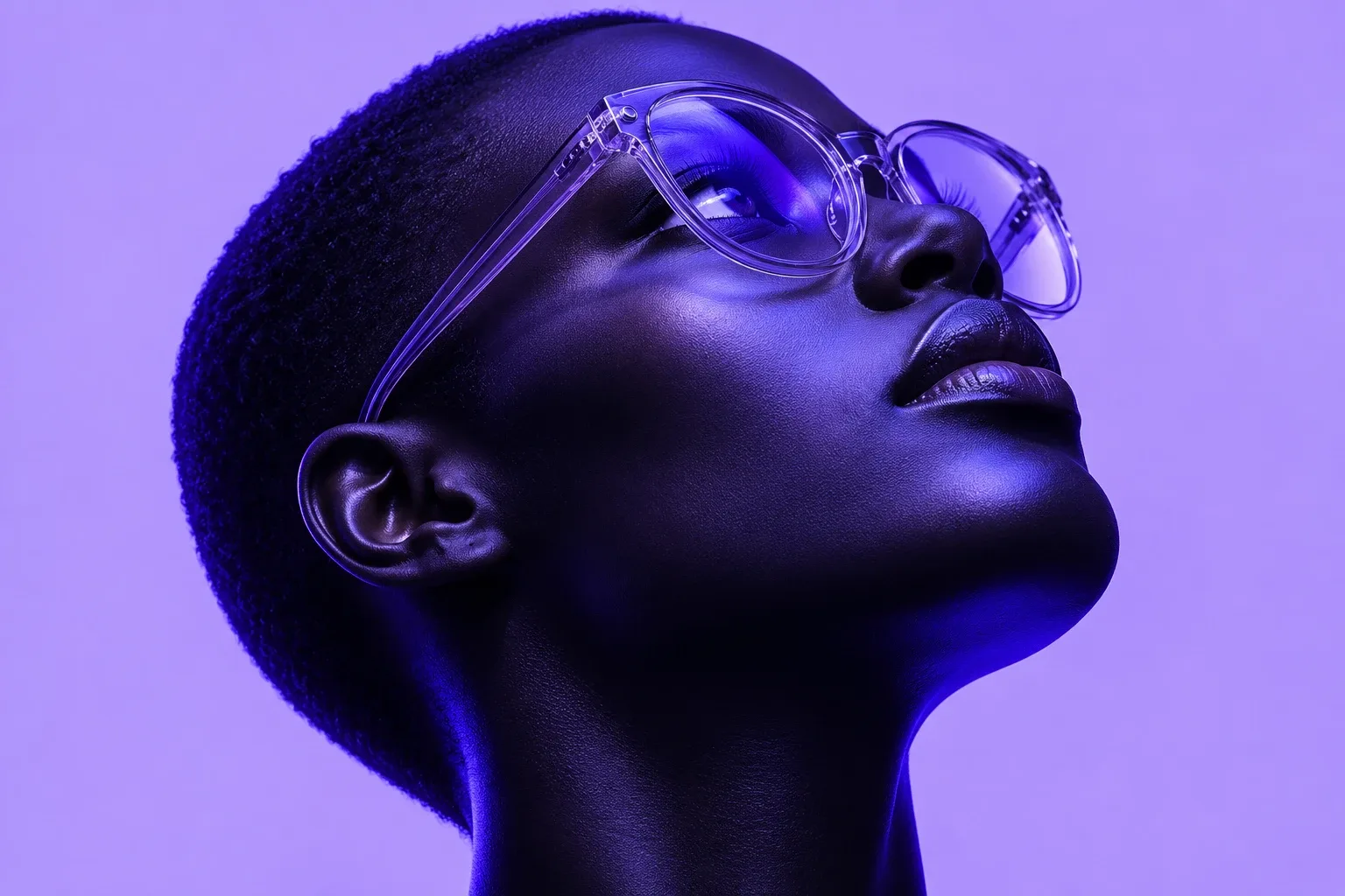 A dark-skinned person in profile, head tilted back looking up, glossy violet-tinted skin